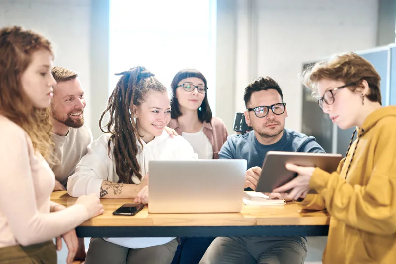 People looking at a tablet together